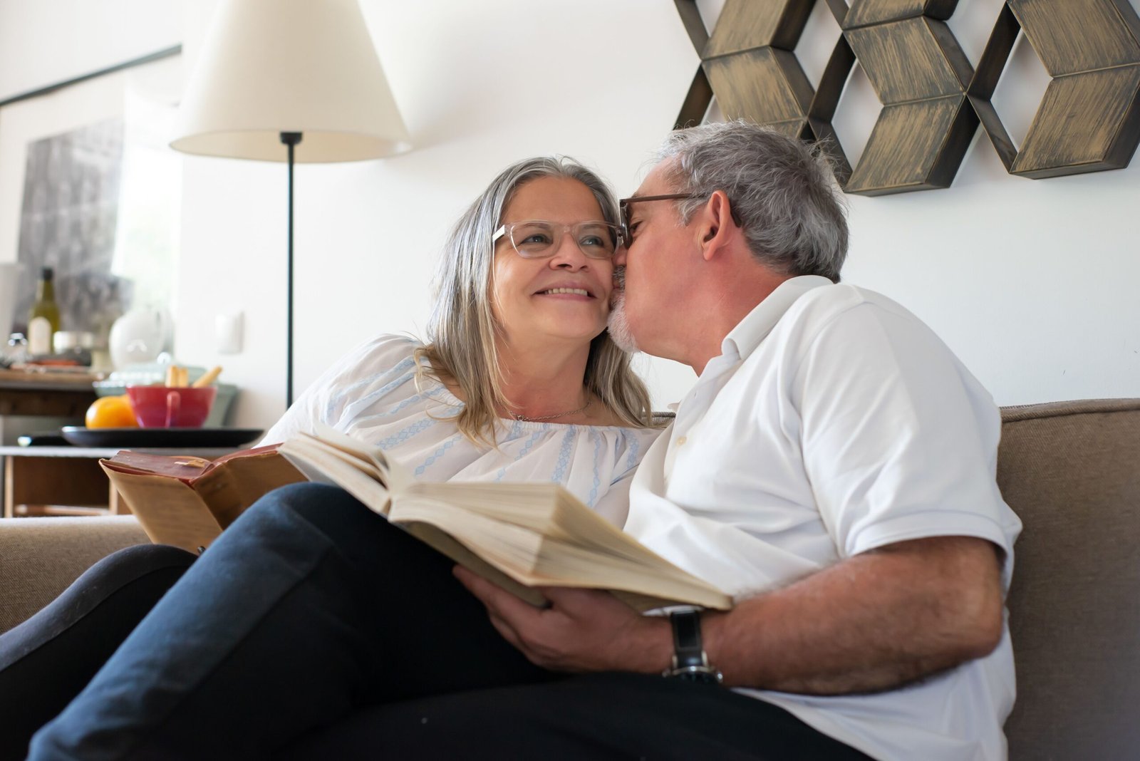 pexels-photo-7477722-7477722 Senior couple relaxing and enjoying a book together indoors in Portugal